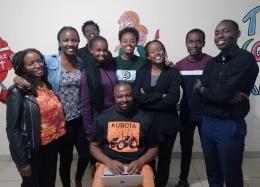 Talmon Mwakesi, who is the founder of Yada Innovations, poses for a photo alongside colleagues.